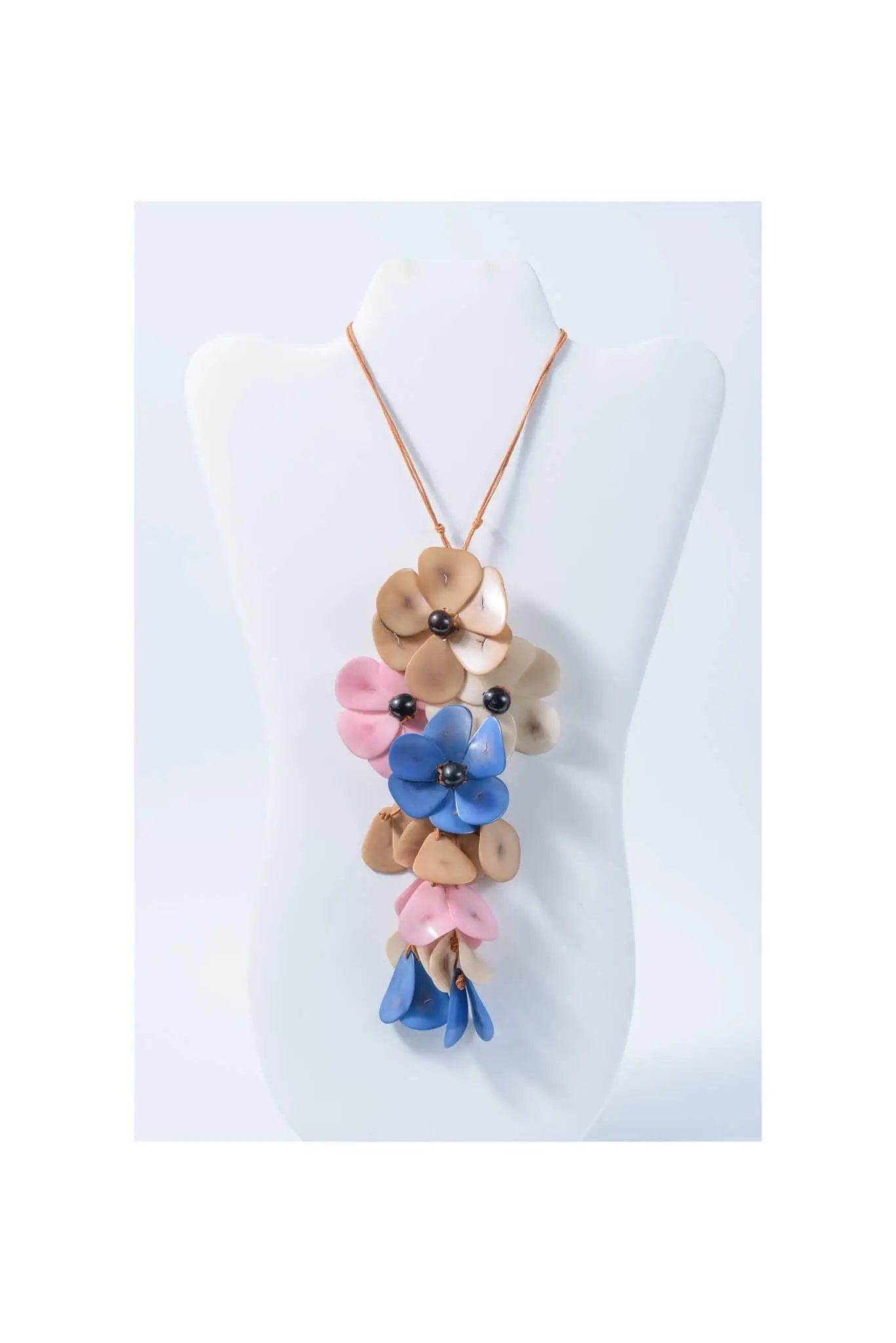 Holly pendant flower tagua necklace with colorful layered blossoms in pink blue and beige tones