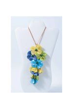 Vibrant holly pendant flower tagua necklace with layered yellow blue green petals and dark green bead accents