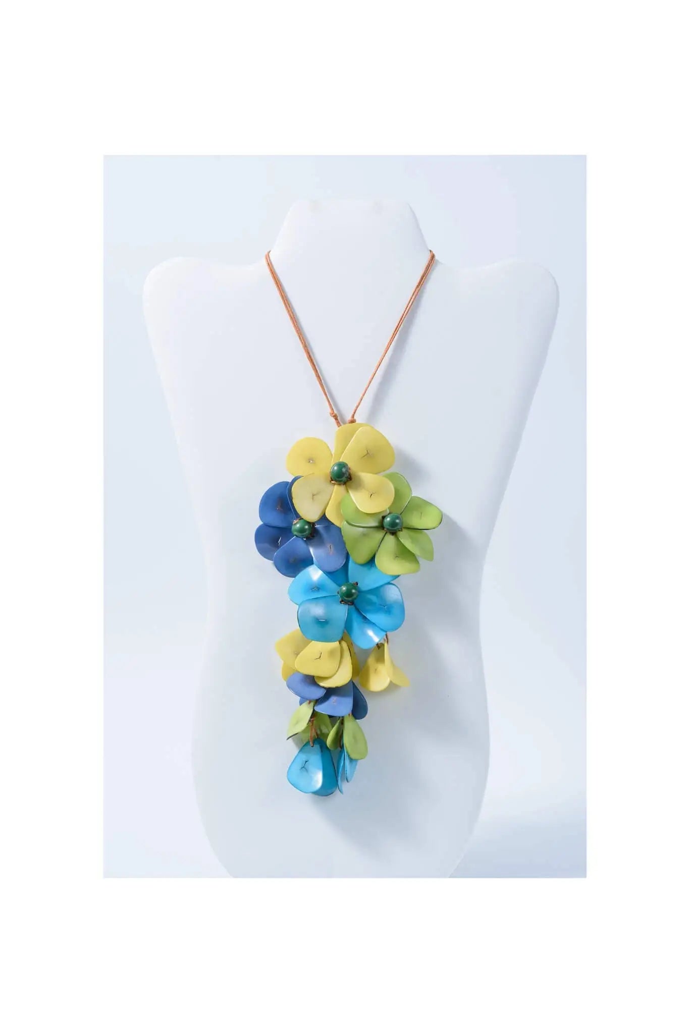 Vibrant holly pendant flower tagua necklace with layered yellow blue green petals and dark green bead accents