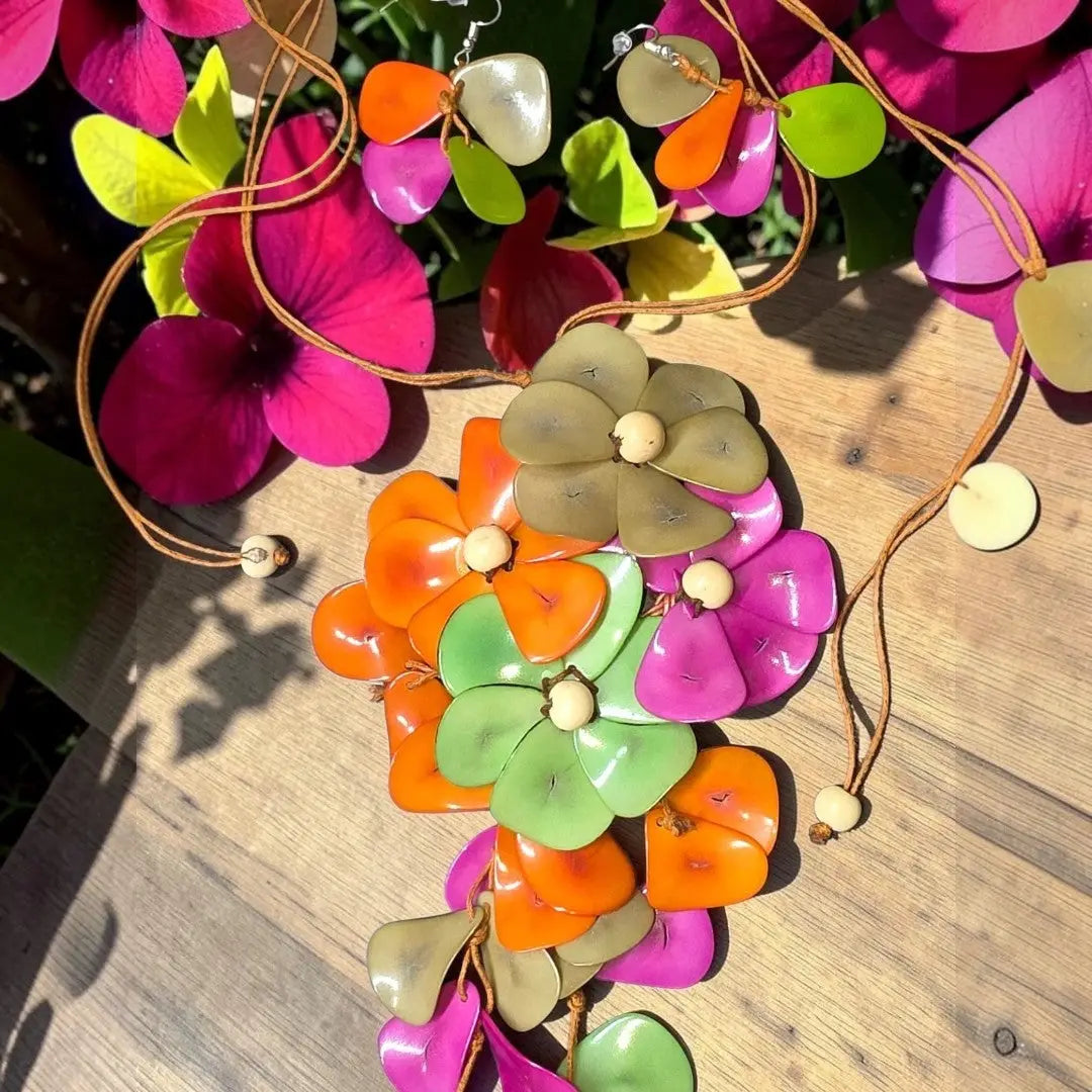 Vibrant holly pendant flower tagua necklace with glossy orange green pink beige resin petals on brown leather cord