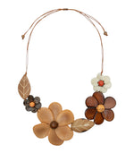 Rustic earth toned ibbie necklace featuring handcrafted tagua nut flowers and leaves made from natural materials