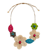 A vibrant ibbie necklace featuring colorful handcrafted wooden tagua nut flowers with turquoise and pink beads