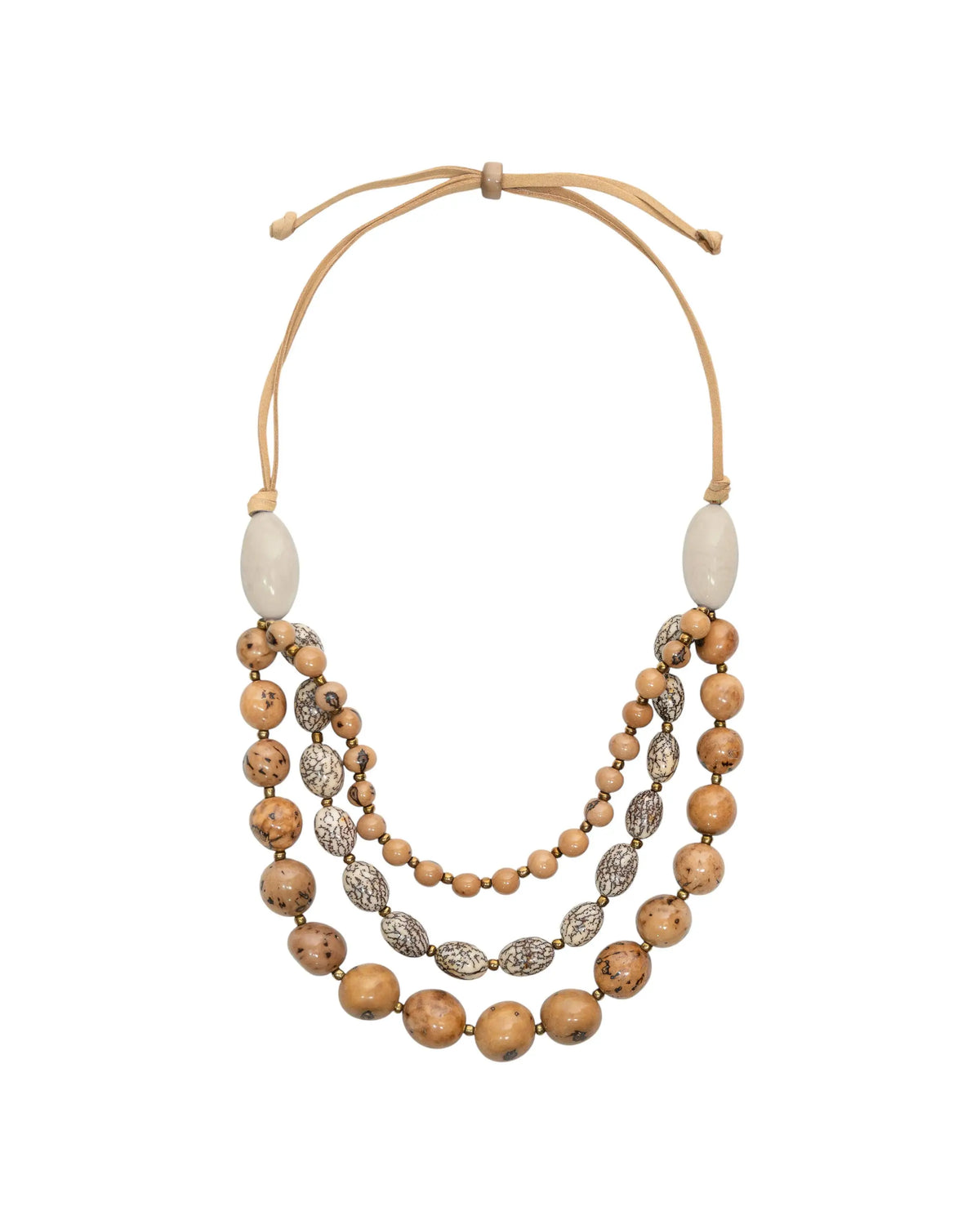 A layered idra necklace with natural wooden beads, silver-patterned discs, and beige leather cords featuring bombona seeds