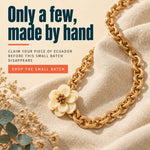 Gold-toned interlocking tagua nut long strand necklace with cream flower charm and brown center from joss necklace features