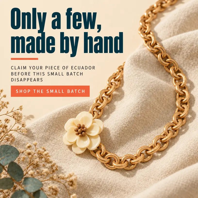 Gold-toned interlocking tagua nut long strand necklace with cream flower charm and brown center from joss necklace features