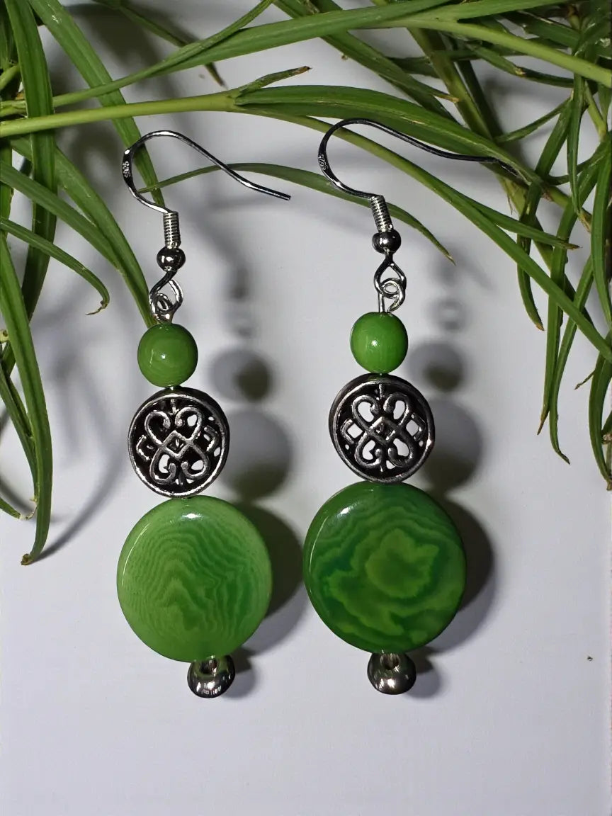 Irish green rainforest tagua nut earrings with green beads silver accents and intricate circular celtic charms
