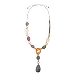 Jacinta necklace with colorful matte and glossy tagua nut beads in gray white purple green and orange linked by gold rings