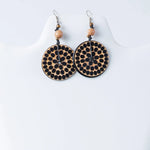 Circular natural tan wooden Lana eco-chic engraved tagua earrings with black dot pattern peach beads and silver hooks