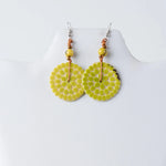 Lime green circular engraved tagua earrings with mosaic dots yellow beads and copper wire from lana eco-chic