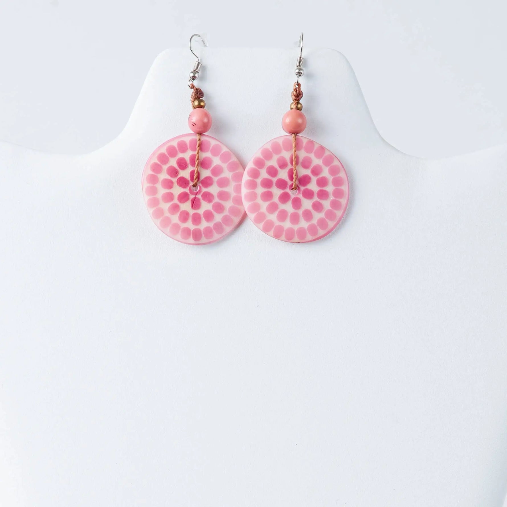 Pink circular engraved tagua earrings with dotted pattern peach beads and gold-toned accents from lana eco-chic