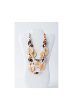 Beige and brown layered necklace with engraved tagua and coconut discs for a bohemian eco-chic look