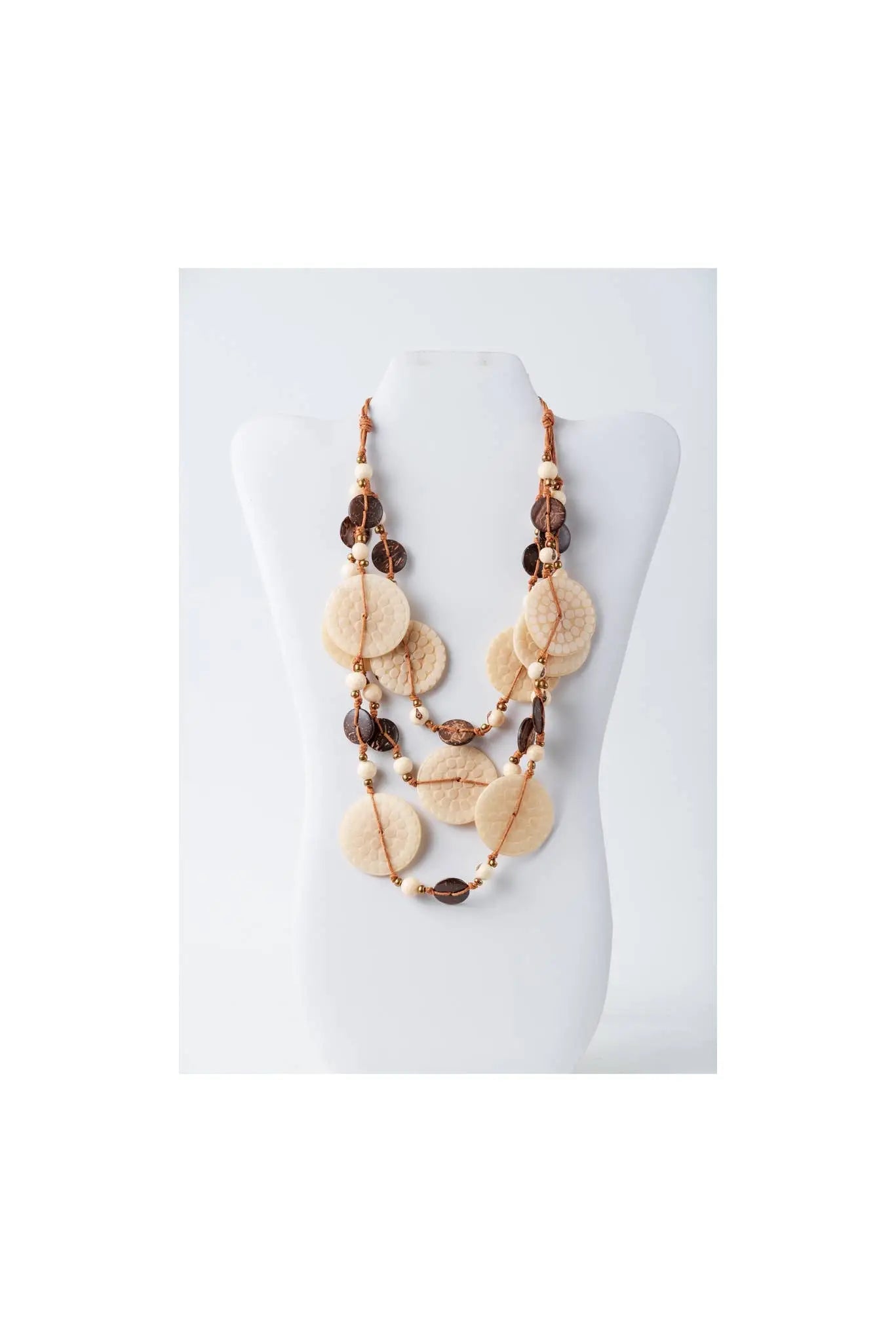 Beige and brown layered necklace with engraved tagua and coconut discs for a bohemian eco-chic look