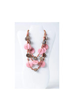 Layered necklace with engraved tagua beads in pink and brown featuring a hammered finish for eco chic style