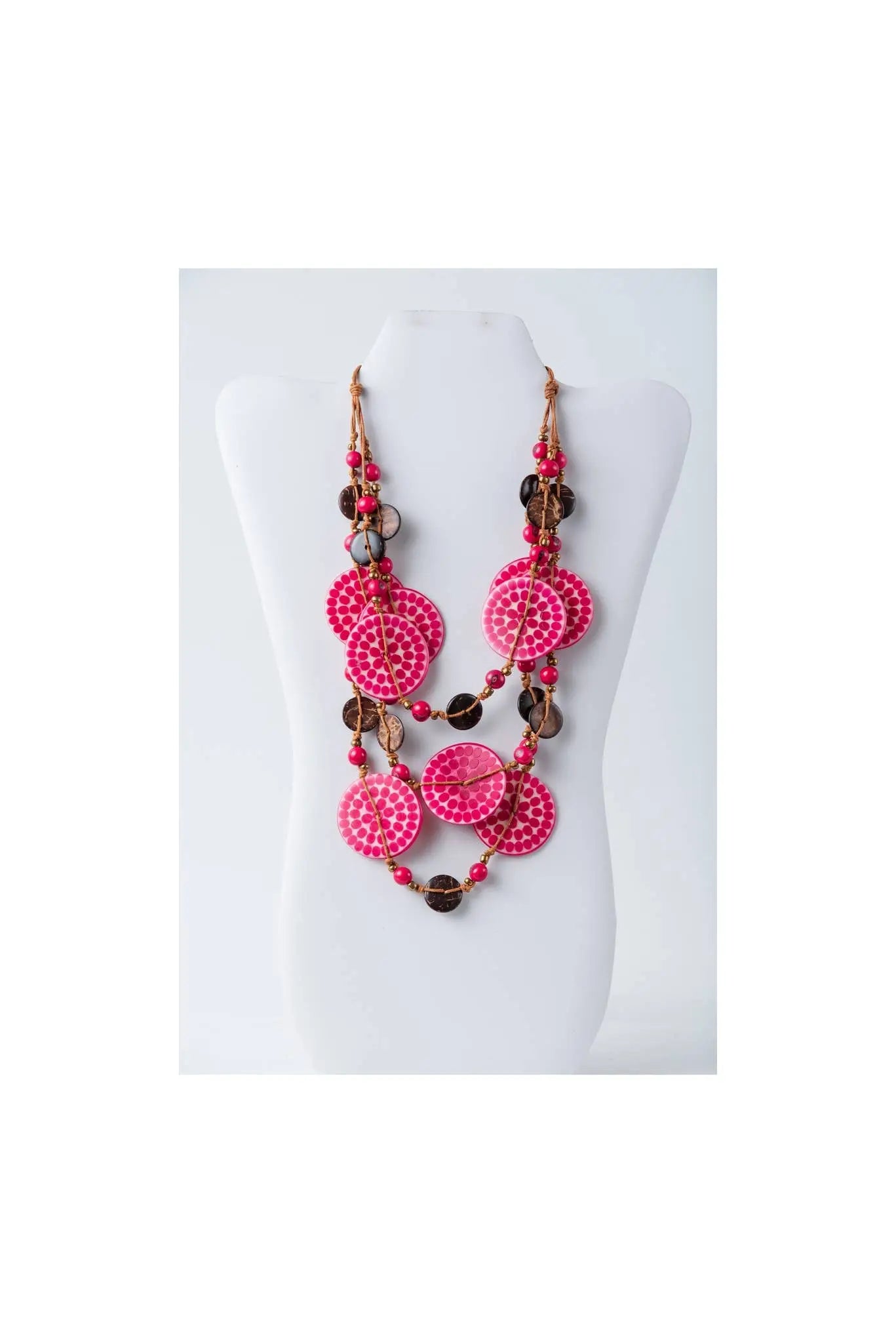 Vibrant pink layered necklace with engraved tagua beads and dark brown coconut accents on adjustable chain