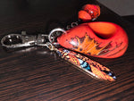 Large carved and polished rust orange tagua handmade bag charm keychain with vibrant orange and black butterfly design