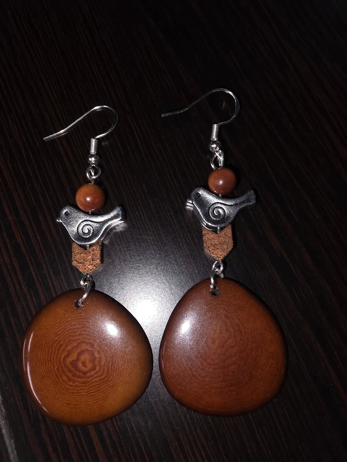 Lightweight chocolate mocha tagua slice earrings with brown wooden discs silver bird charms and amber beads