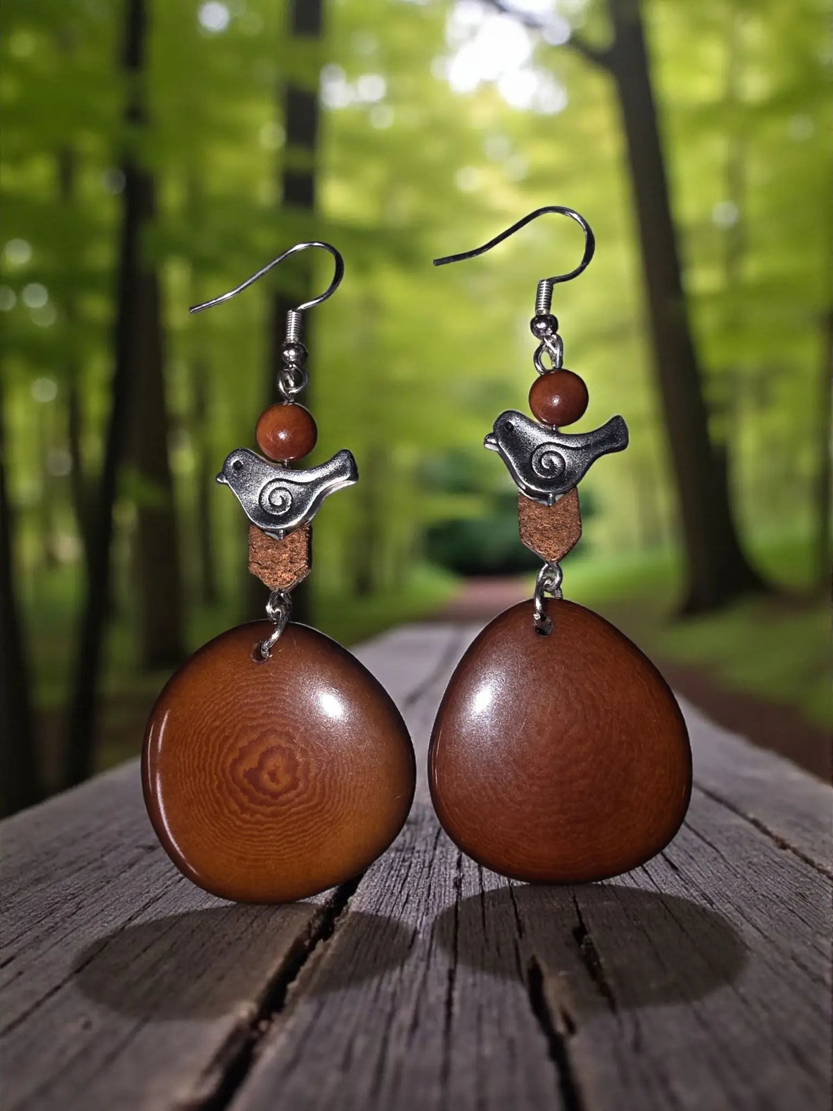 Lightweight chocolate mocha tagua slice earrings with brown wooden discs silver bird charms and copper accents