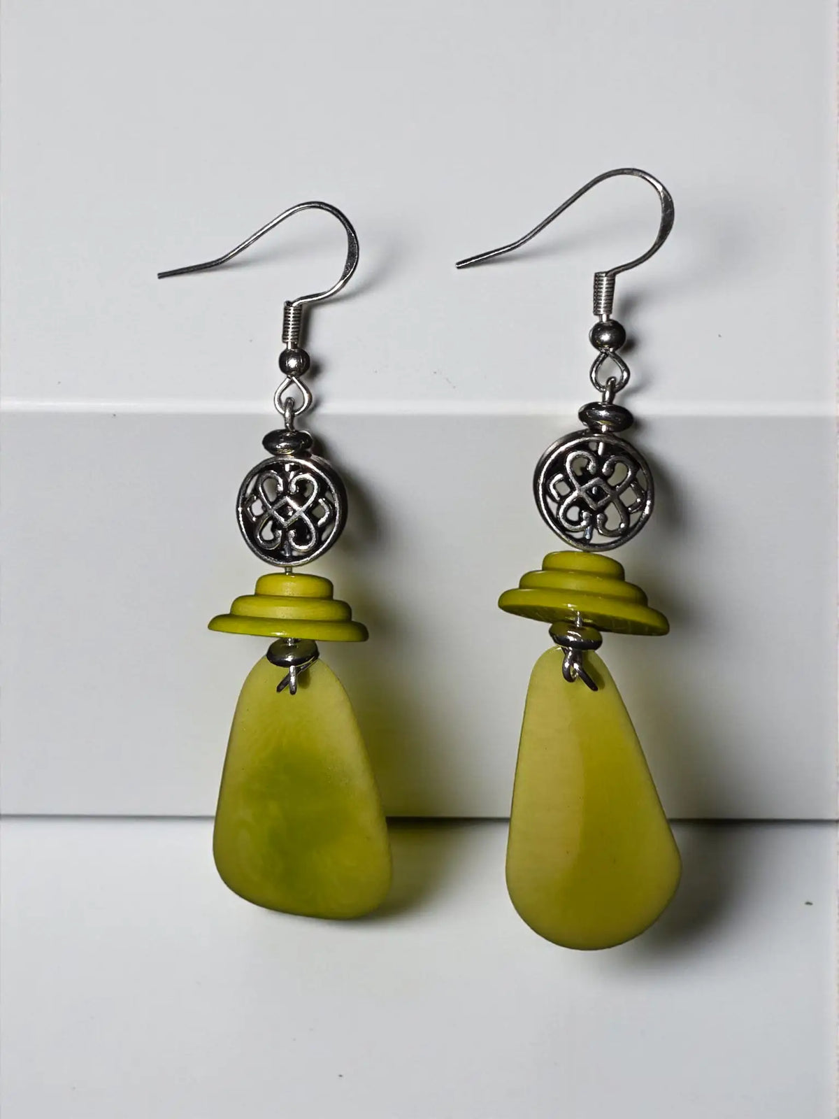 Vibrant lime green fan tagua handmade lightweight earrings with silver filigree accents and hook closures