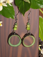 Lime Sherbert natural edge tagua hoop earrings with green matte hoops and three graduated green beads on silver hooks