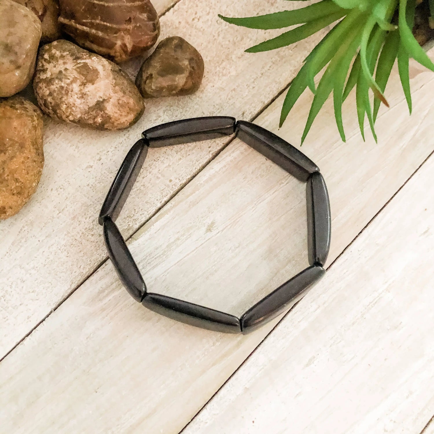 Loja bracelet black made of elongated oval black beads forming a flexible octagonal outline design