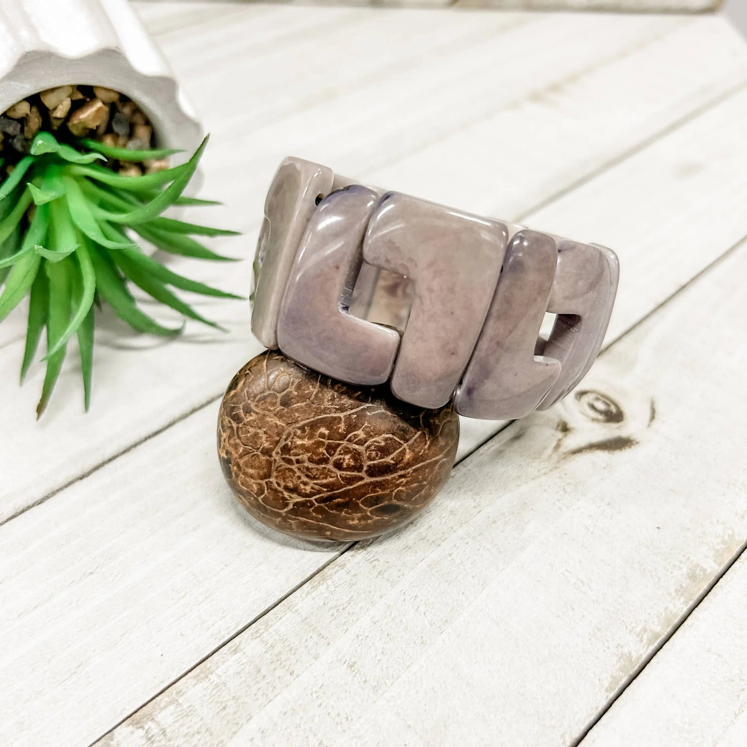 A sleek matte lavender-gray bangle bracelet with a modern geometric design called lyla bracelet gray