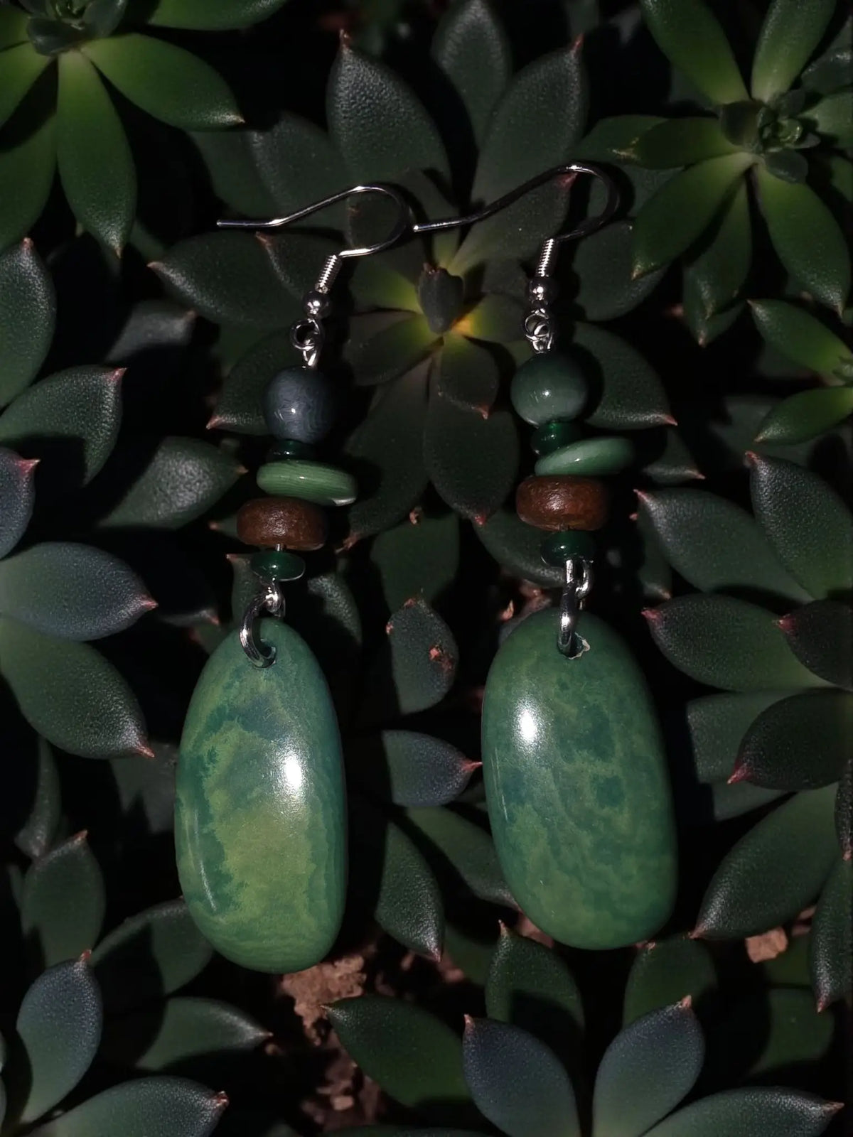 Magnificent galaxy green natural grain tagua earrings with green jade-like oval pendants and layered green brown gray beads