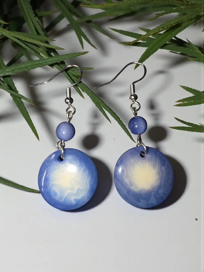 Blue gradient disc earrings with white swirl pattern and silver fishhook clasps from turbulent misty collection