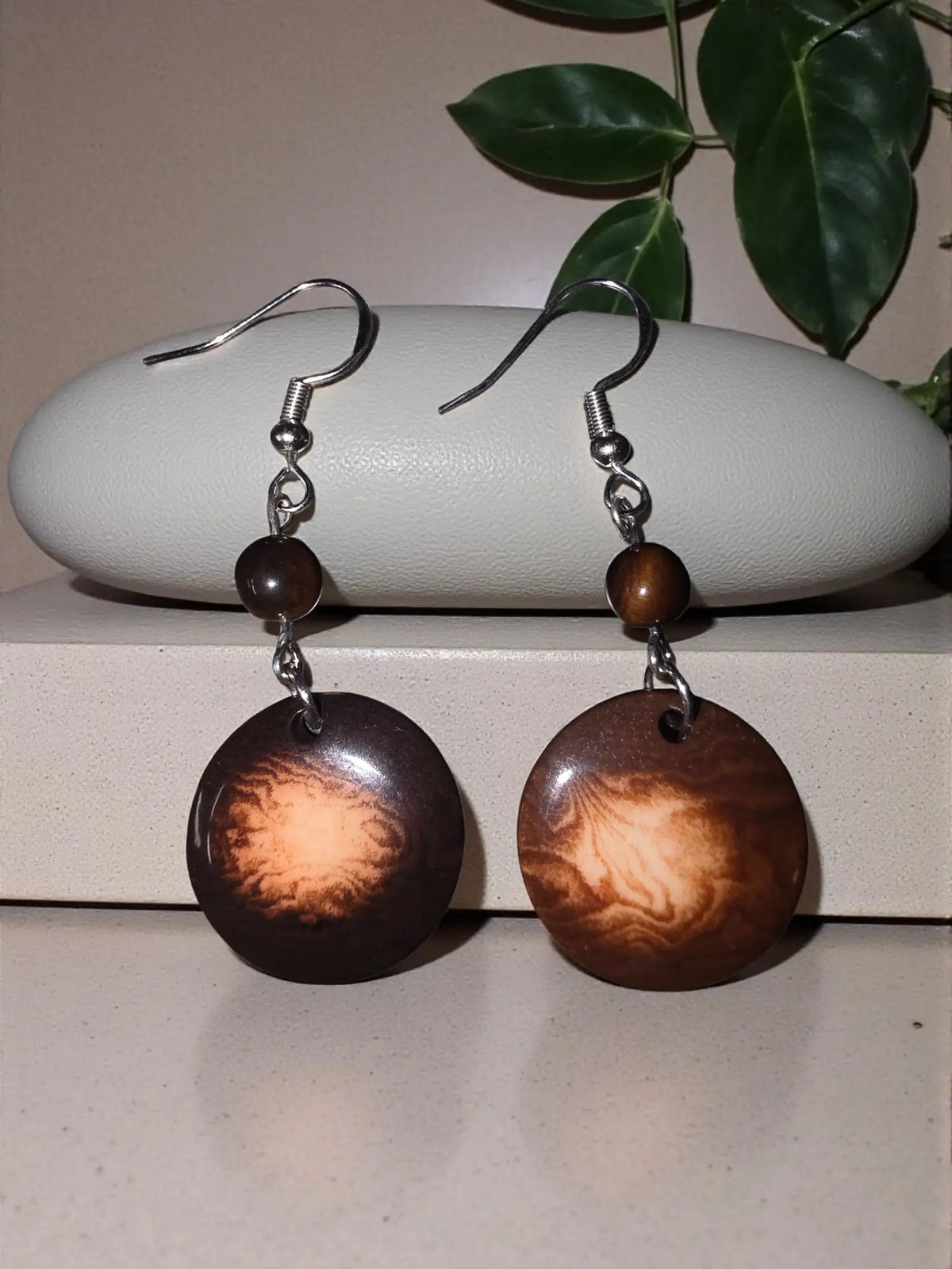 Brown circular wooden vegetable ivory earrings with amber pattern and dark brown beads handmade in usa rainforest eco-friendly