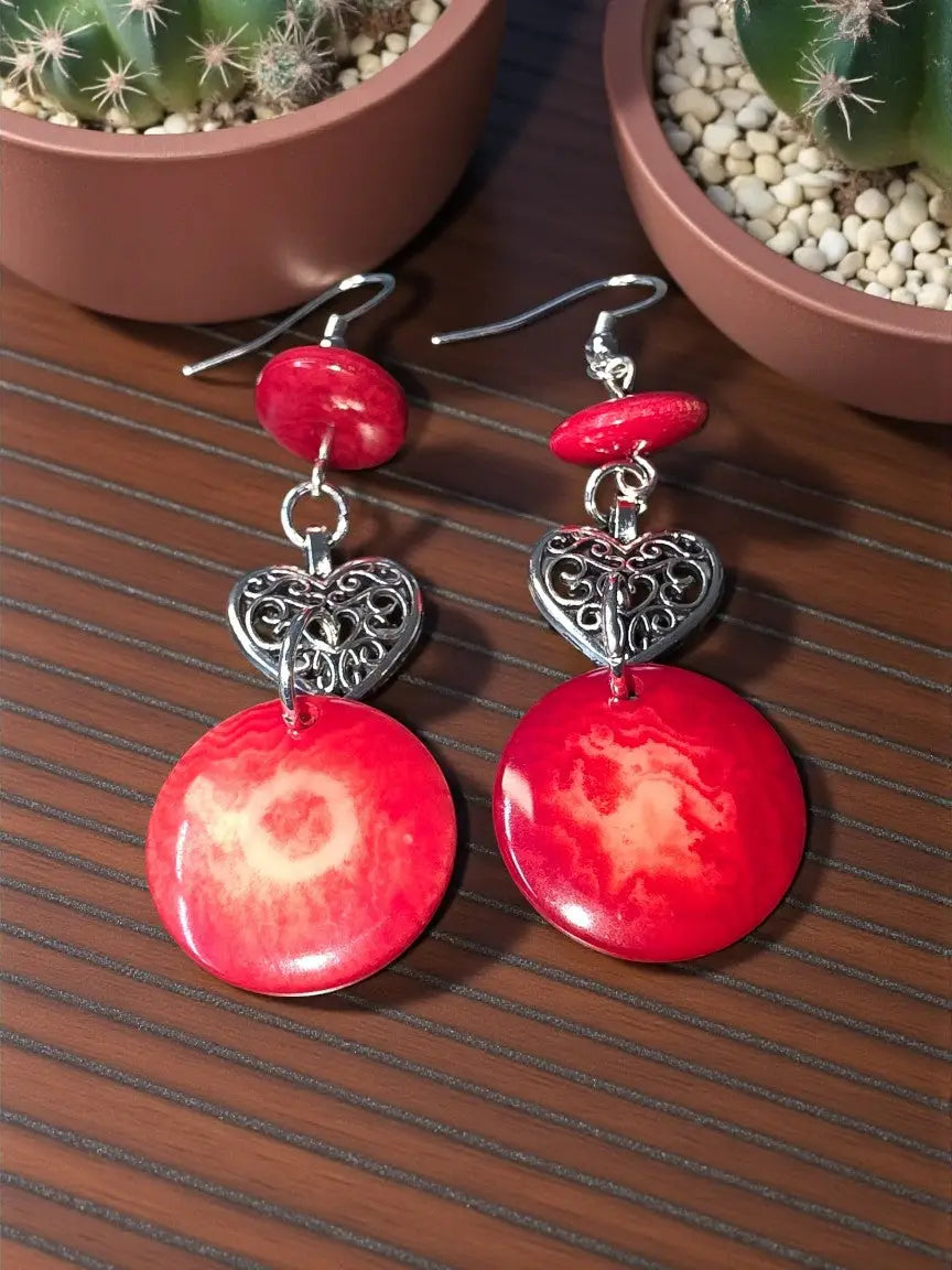 Red heart-shaped earrings with intricate silver filigree and marbled red pendant from misty collection eco-friendly from usa