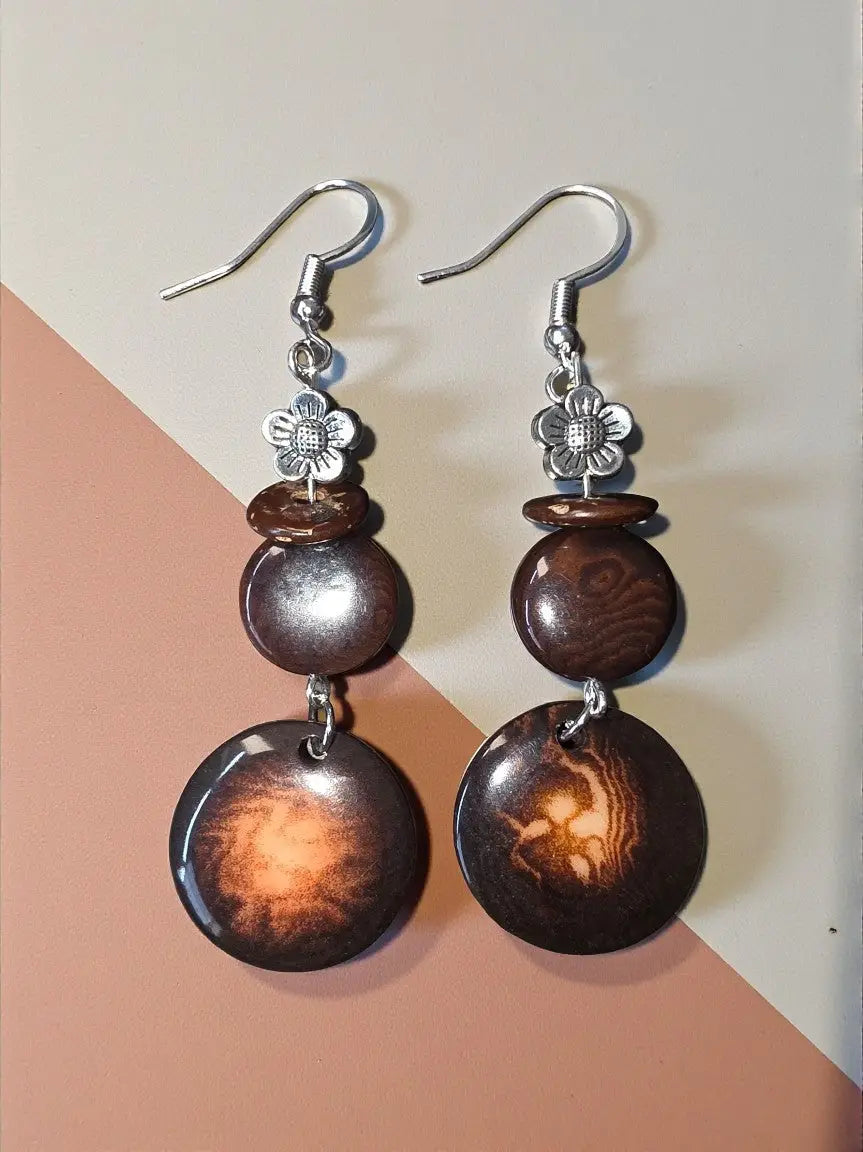 Brown wooden disc dangle earrings with silver flower charms and hooks from turquoise misty eco-friendly collection