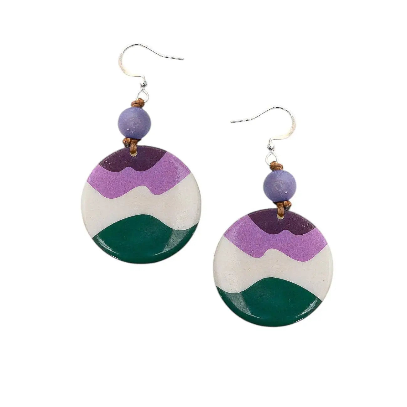 Mauren earrings with purple white and green layered tagua nut circles and a small purple bead above each hook