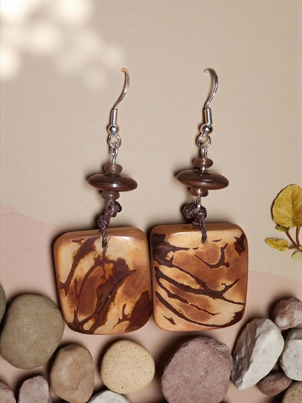 Mauve-y mocha square raw edge marble polished tagua earrings with brown and tan marbled pattern on silver hooks