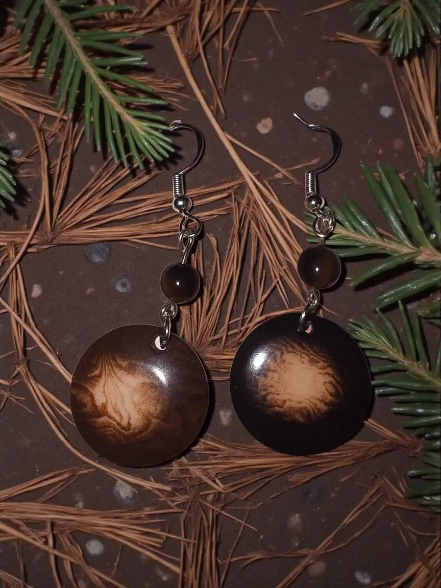 Dark brown circular misty chocolate tagua carved nut earrings with swirling marbled pattern and small dark beads from ecuador