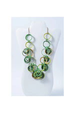 A vibrant green and yellow chunky beaded tagua circles necklace with copper toned hooks from mona bold collection