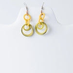 Bright yellow and olive green resin tagua earrings with modern layered circular design perfect for statement looks