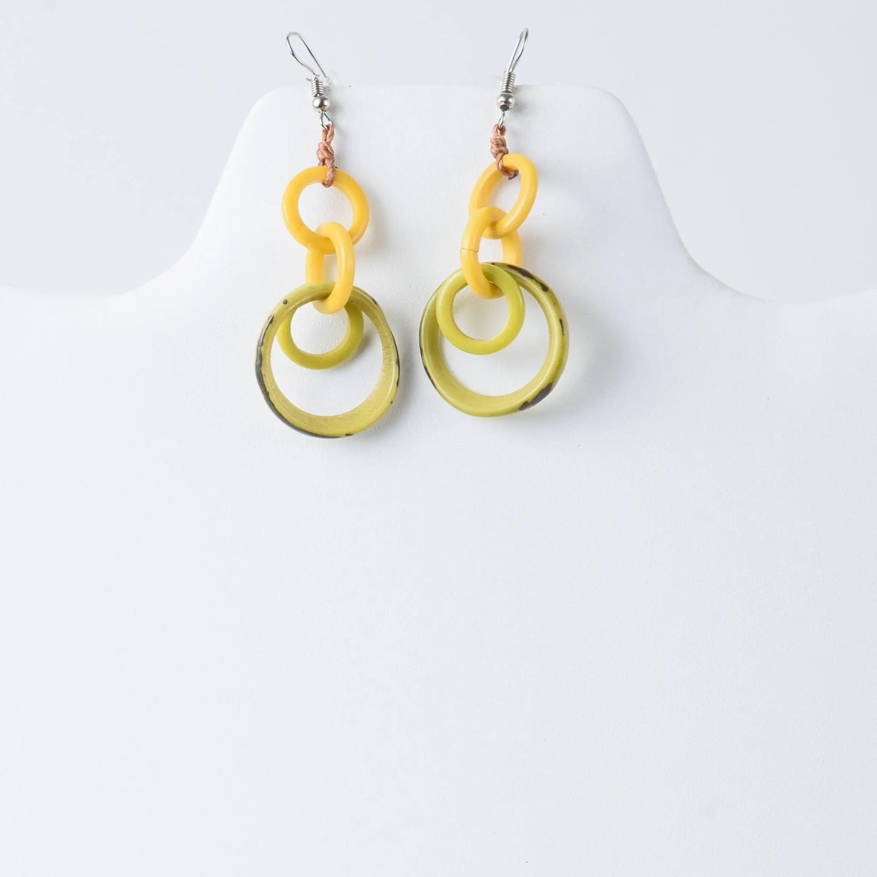 Bright yellow and olive green resin tagua earrings with modern layered circular design perfect for statement looks