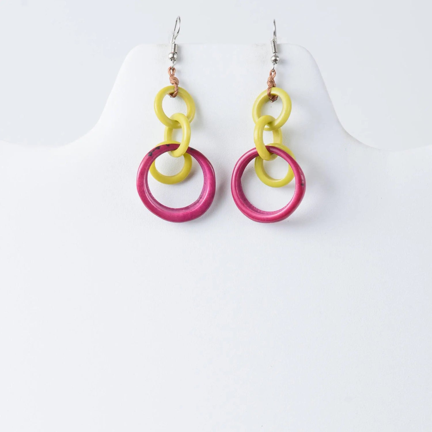 Bright yellow and fuchsia pink layered circle tagua earrings with a modern design for statement looks