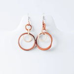 Terracotta and cream circular layered hoop tagua earrings with an interlocking design perfect for statement wear