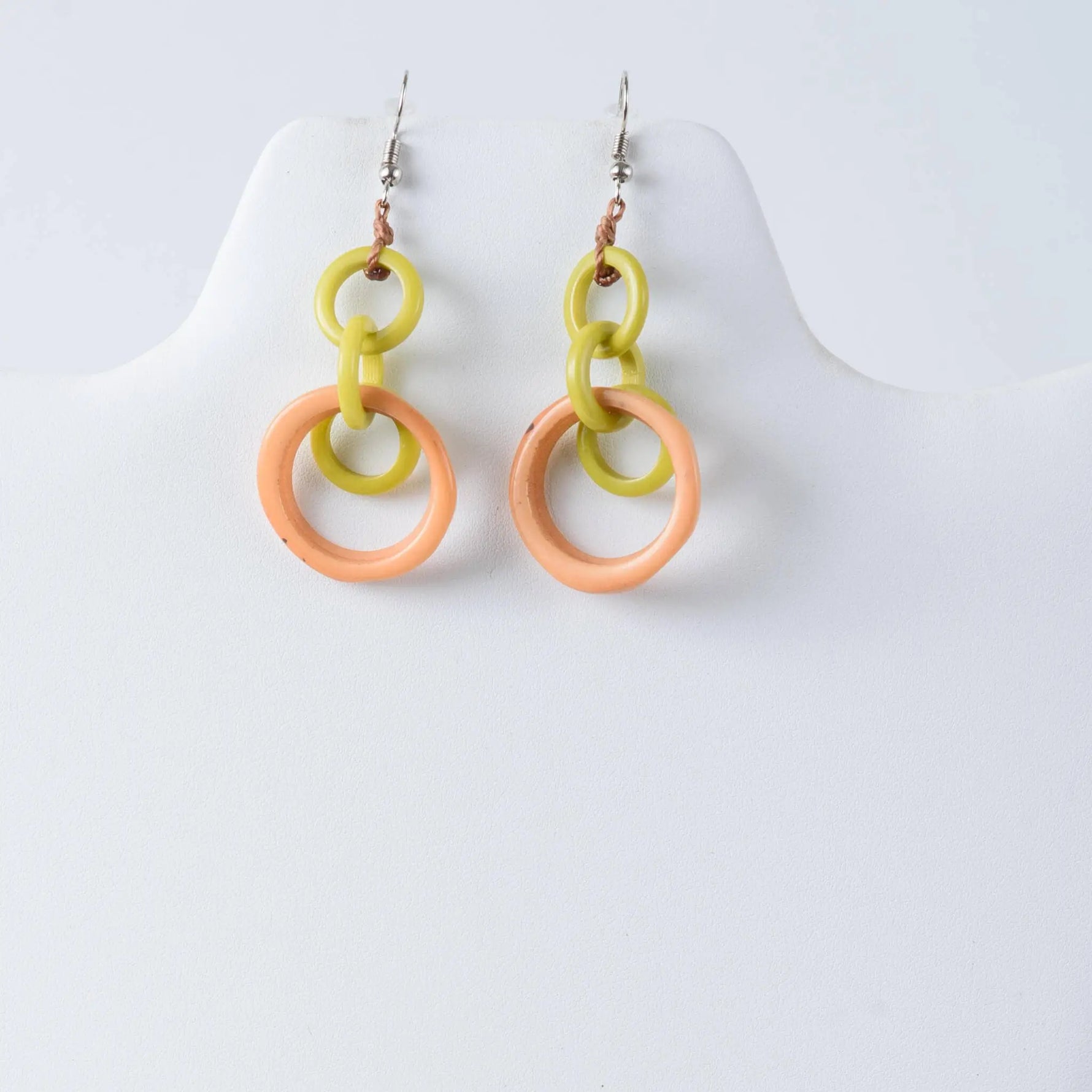 Mona drop and dangle circle statement tagua earrings with vibrant lime green and peach resin rings