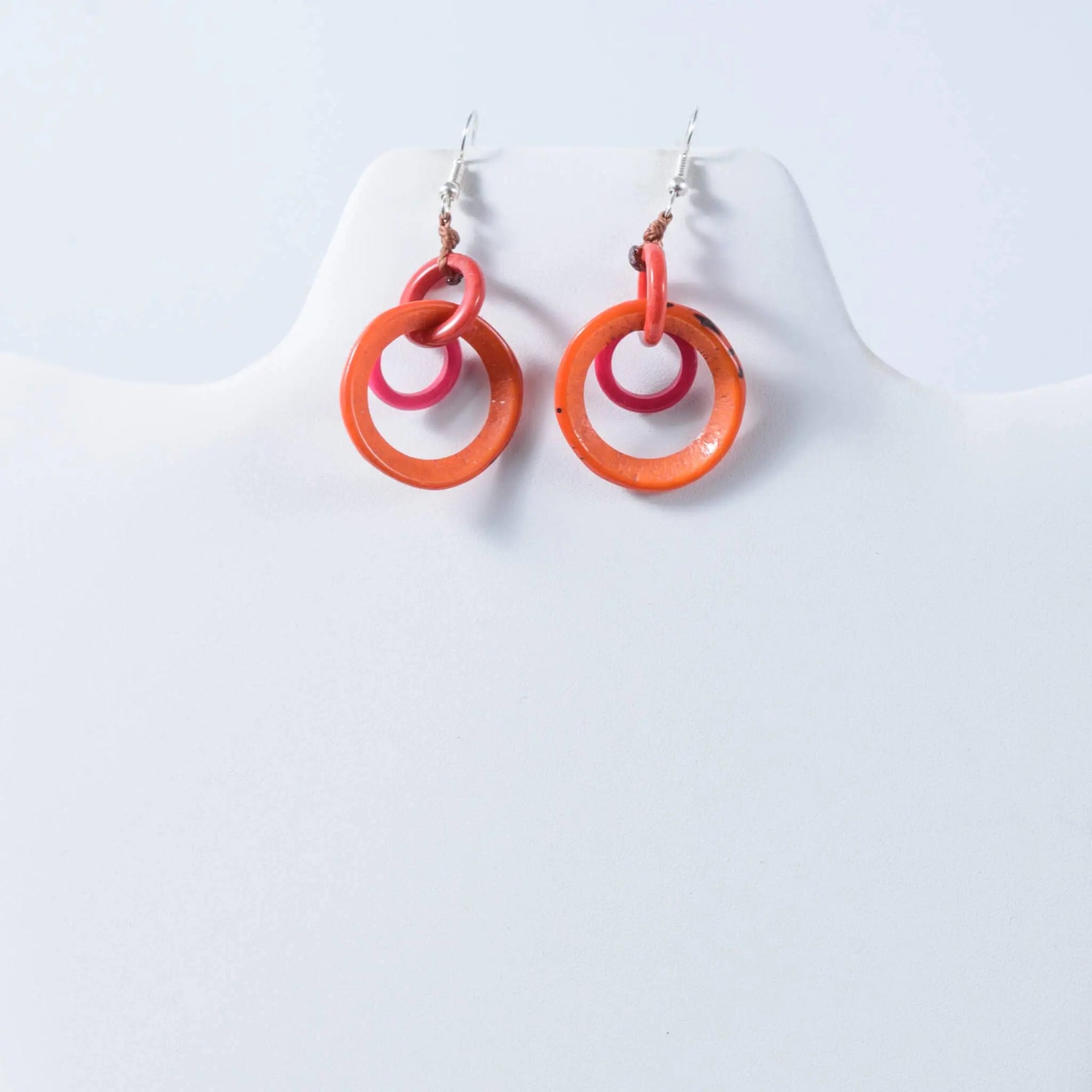 Vibrant orange and pink double-ring glossy tagua earrings perfect as statement drop and dangle circles