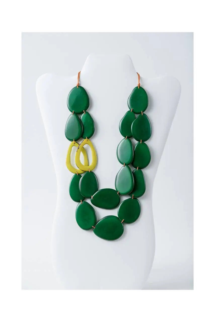 Naty dual-strand sculptural tagua necklace with bold green teardrop beads and a central yellow circular accent