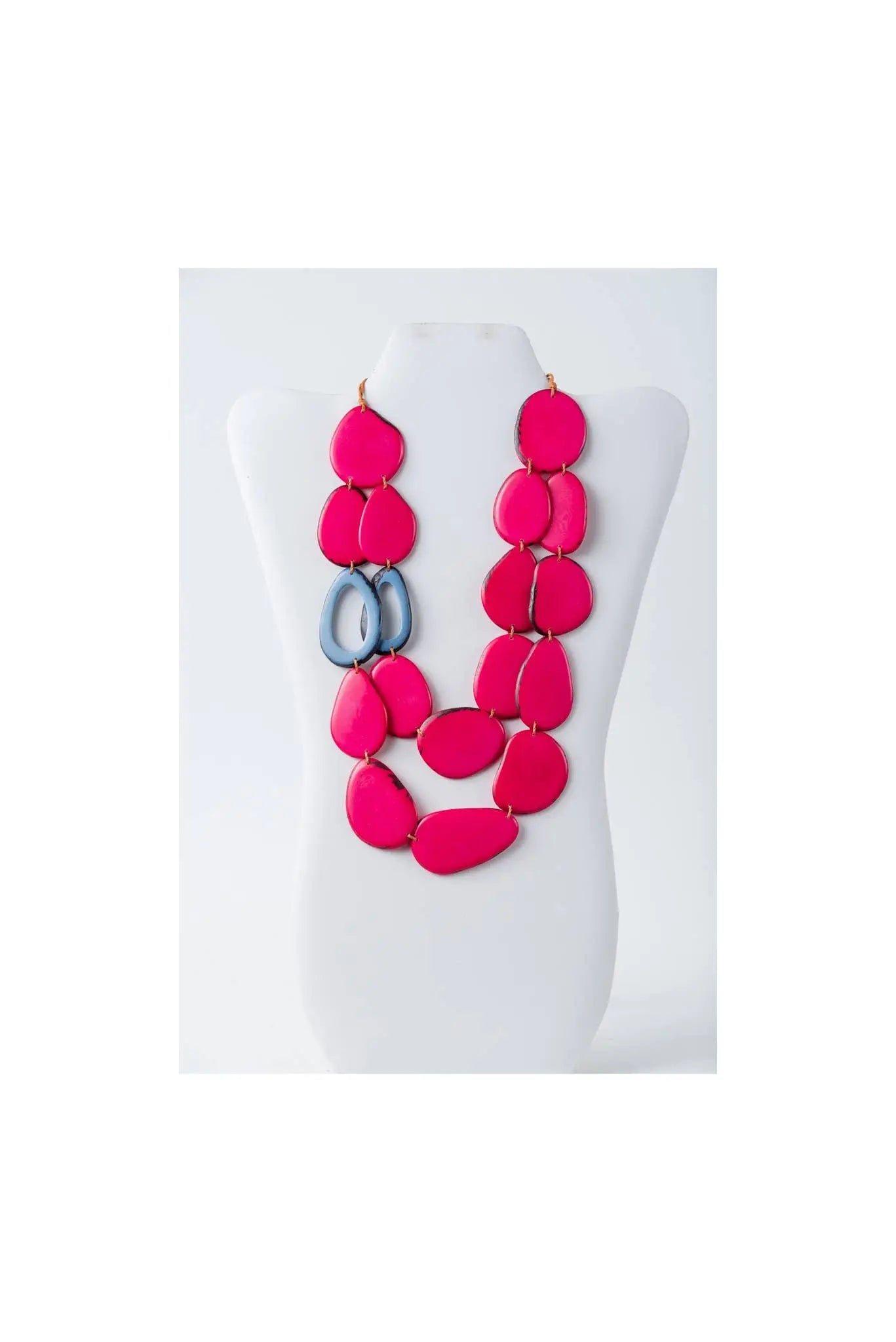 Vibrant fuchsia and gray dual-strand sculptural tagua necklace with teardrop-shaped beads perfect for statement style