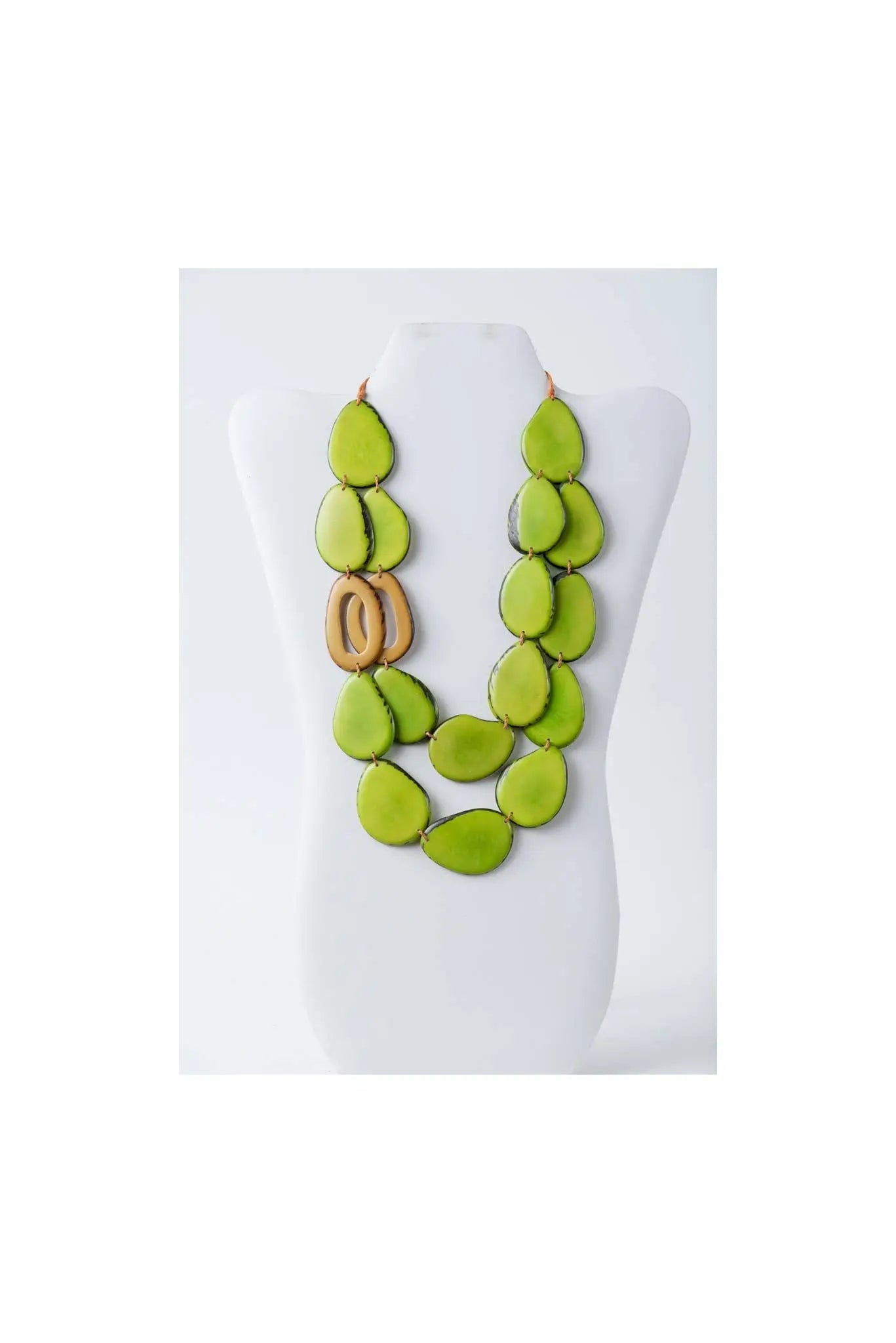Vibrant lime green teardrop tagua beads with wooden o-ring accent make up the bold naty dual-strand sculptural necklace