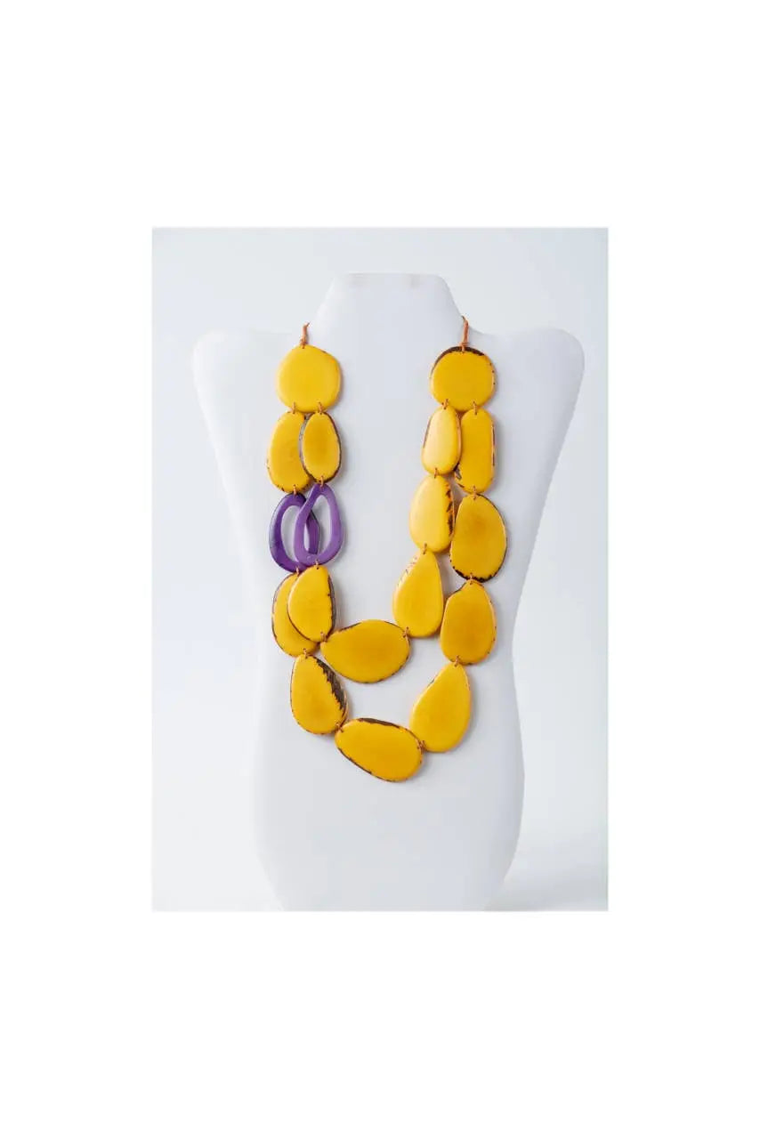 Vibrant yellow and purple naty dual-strand sculptural tagua necklace with smooth teardrop-shaped beads