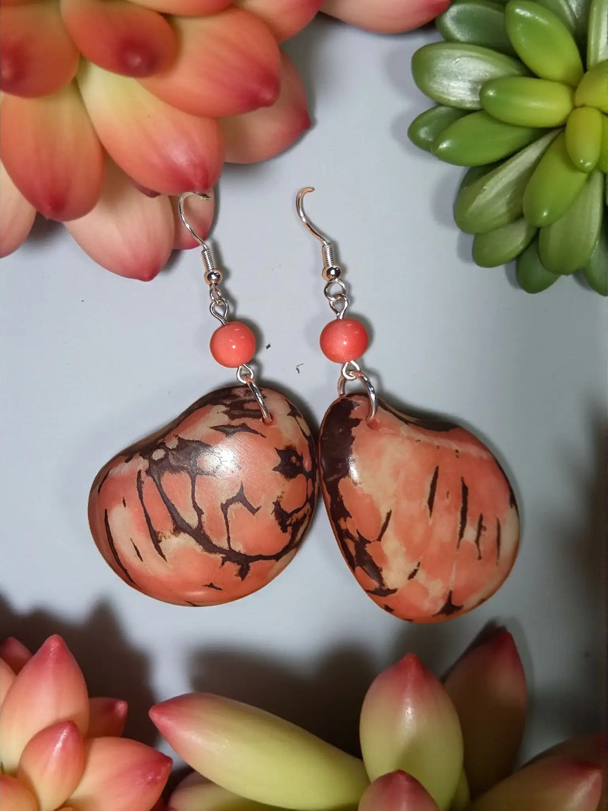 Peachy marble thick top cut tagua dream earrings with coral and brown patterned wooden drops and silver hooks