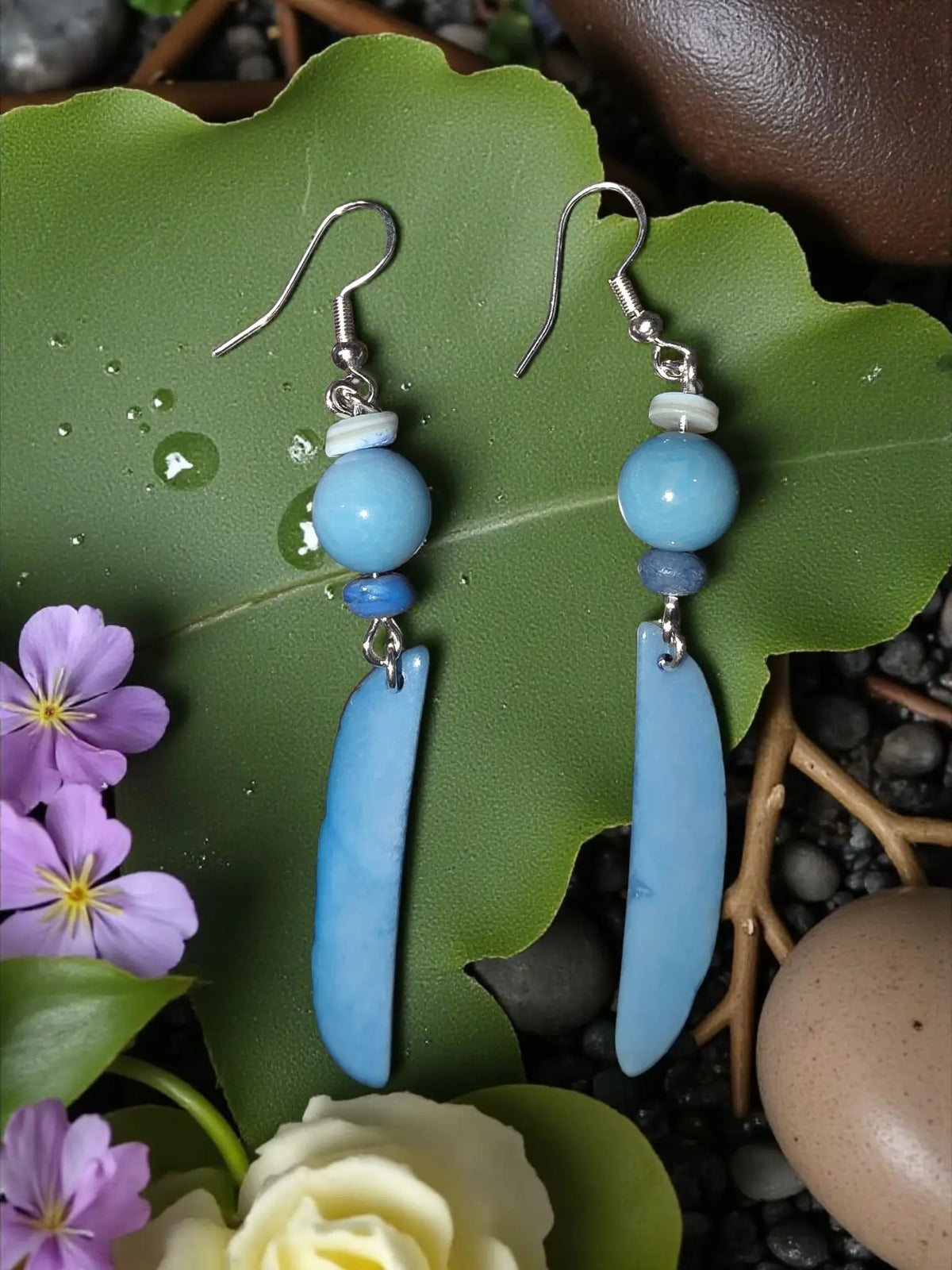 Periwinkle pretty pair tagua earrings with light blue smooth elongated beads silver hooks and small white accent bead