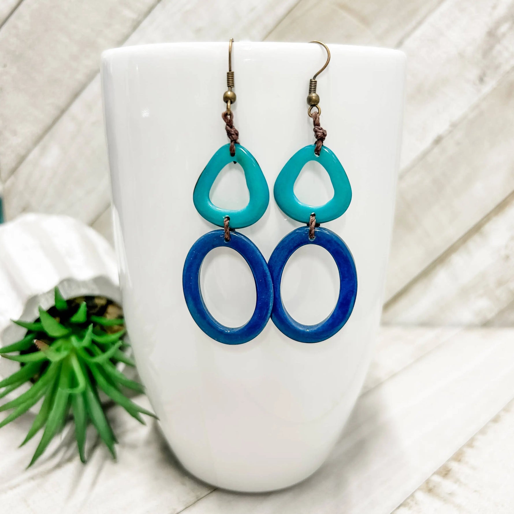 Teal and blue oval playa earrings with rustic brown cord detail perfect for casual and beachwear styles