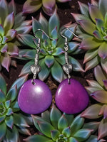 Plum purple teardrop tagua nut earrings with silver-toned swirly heart bead charms and hooks
