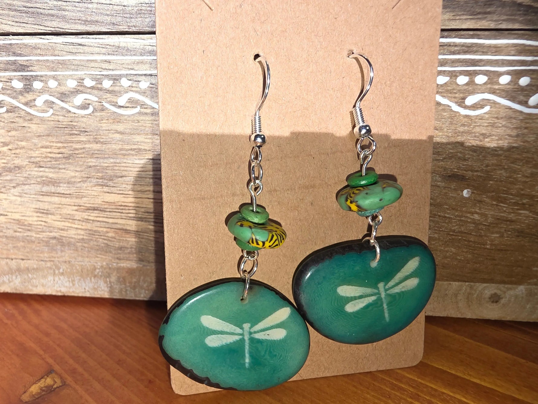 Precious dragonfly turquoise dyed teal earrings with glossy stone finish and silver-toned hooks