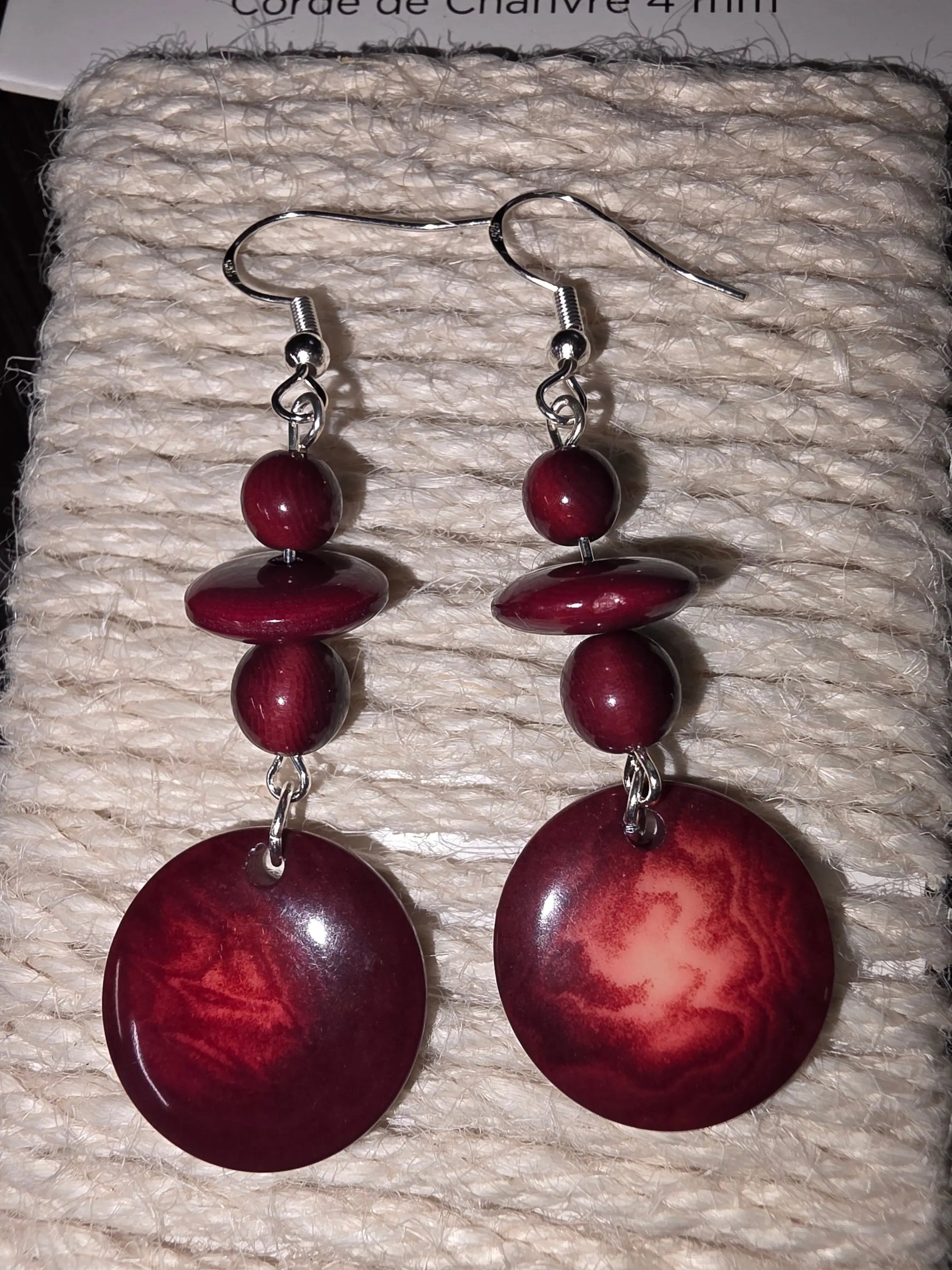 Pretty crimson burgundy round disc tagua grain earrings with deep red glossy marbled wooden discs and silver hooks
